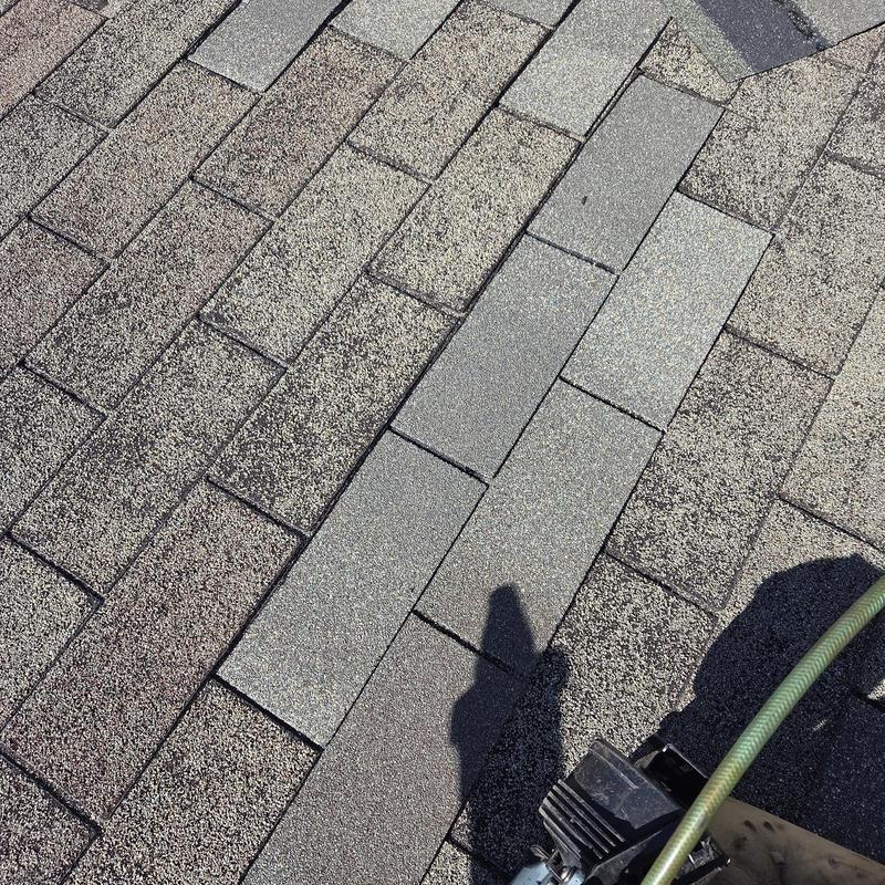 Shingles with replaced pipe boot on roof surface