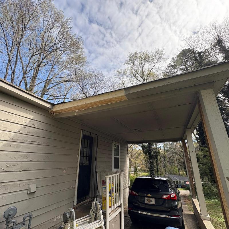Fascia board replacement and painting on porch roof