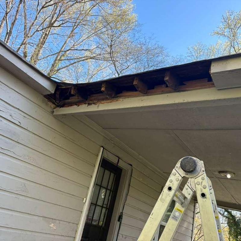 Fascia and soffit framing with ladder nearby