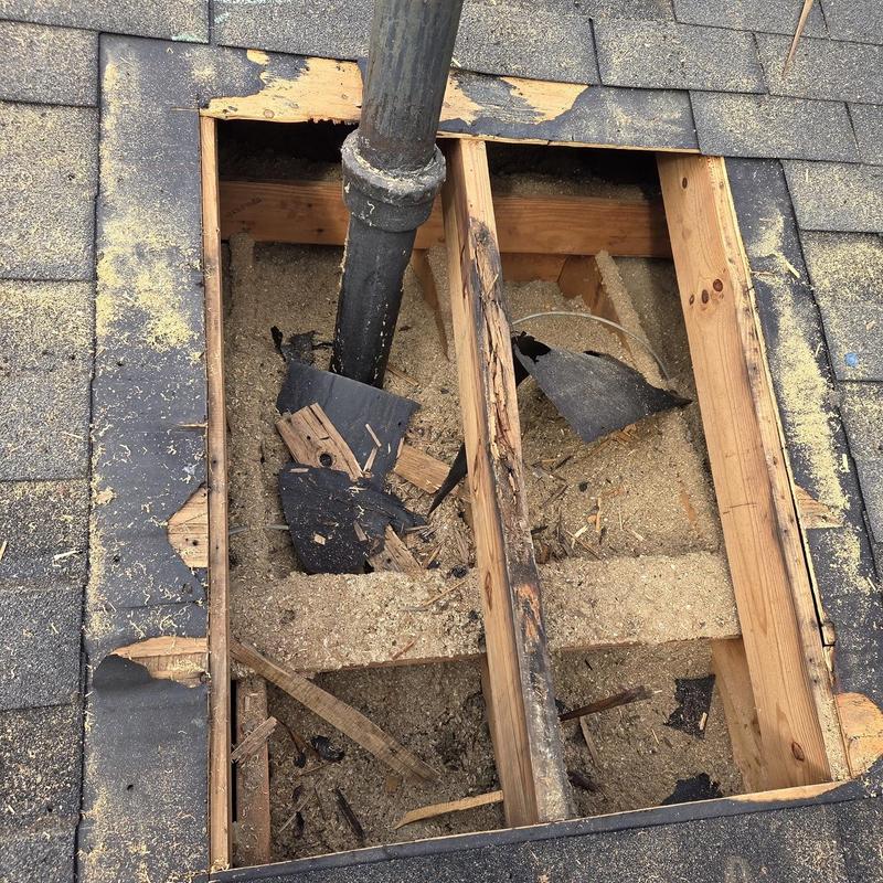 Roof decking board with pipe boot removal damage