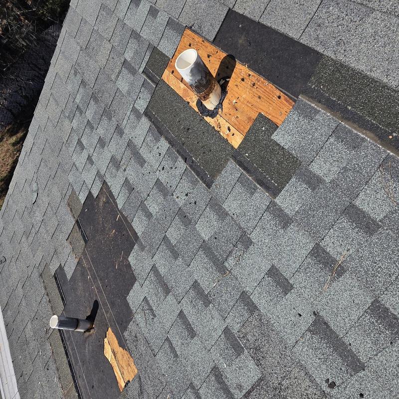 Pipe boots and roof shingles replacement on gray shingles