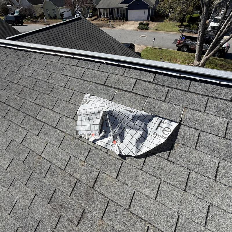 Pipe boot roofing underlayment exposed on shingled roof