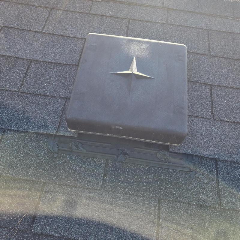 Roof vent with new caulking on shingles