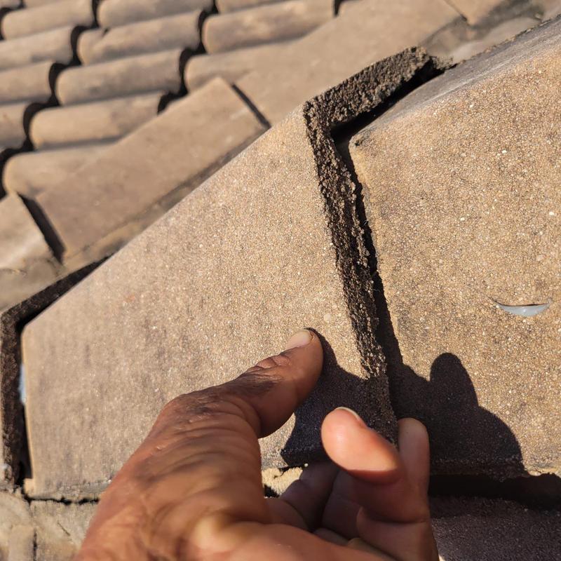 Concrete tile roof showing broken tile detail