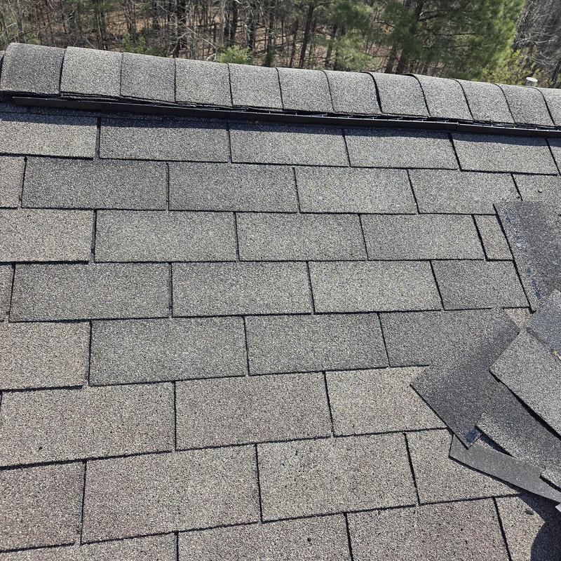 Asphalt shingles and ridge vent on roof replacement