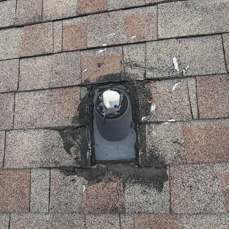 Pipe boot with new sealant on shingle roof