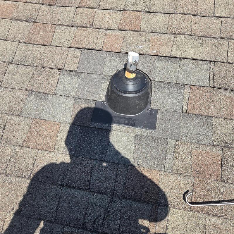 Pipe boot installation on asphalt shingle roof with vent