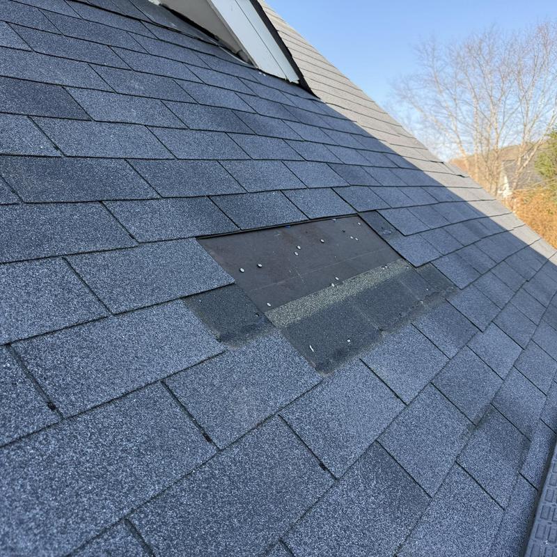 Asphalt shingles with missing section on roof