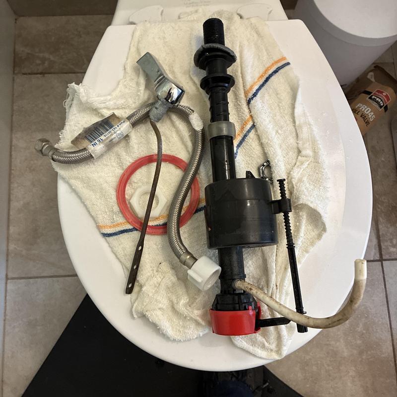 Toilet fill valve and parts replacement on towel