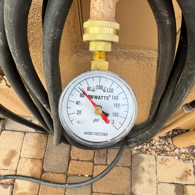 Pressure reducing valve gauge with piping connections