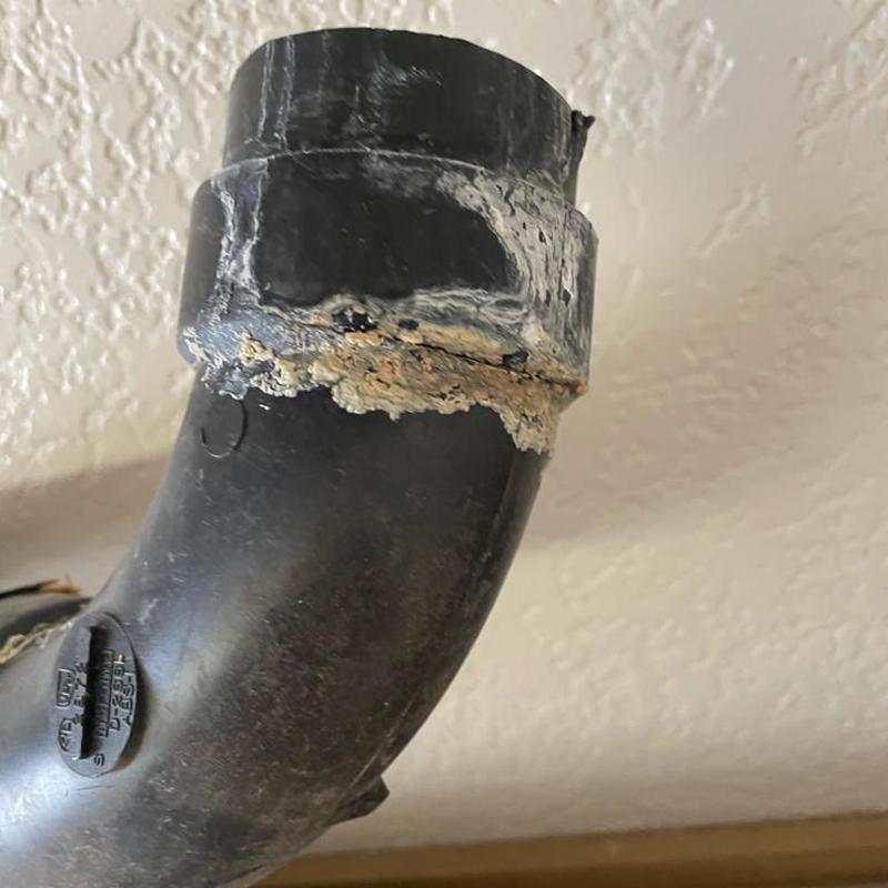 2-inch kitchen ceiling drain pipe with corrosion buildup