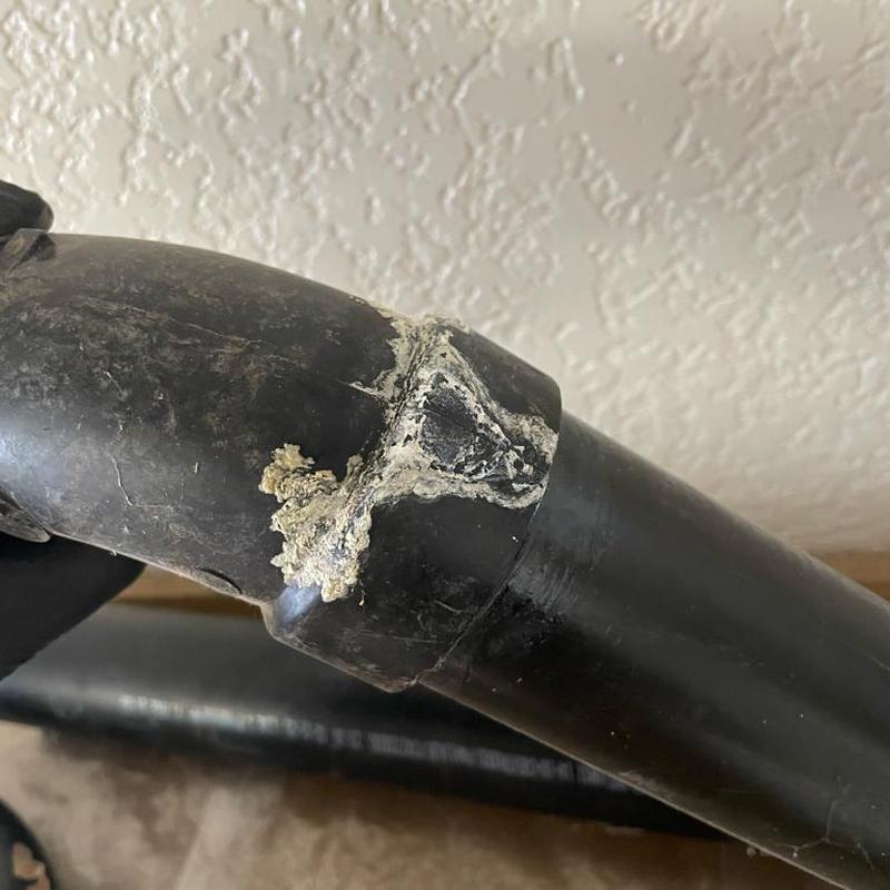 2-inch kitchen ceiling drain line with residue buildup