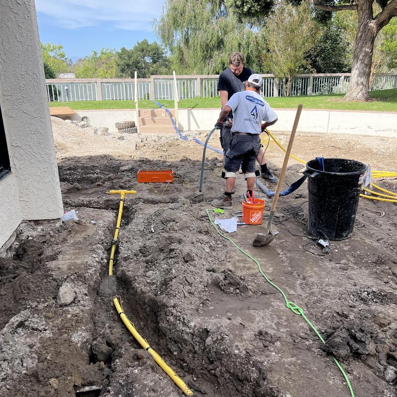 Gas line trench with poly pipe and tracer wire installation Gas line trench with poly pipe and tracer wire installation