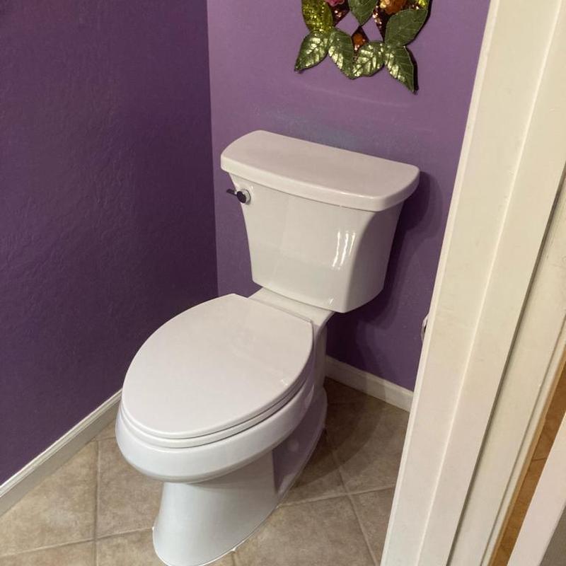 Toilet with new wax ring installed in bathroom corner Toilet with new wax ring installed in bathroom corner