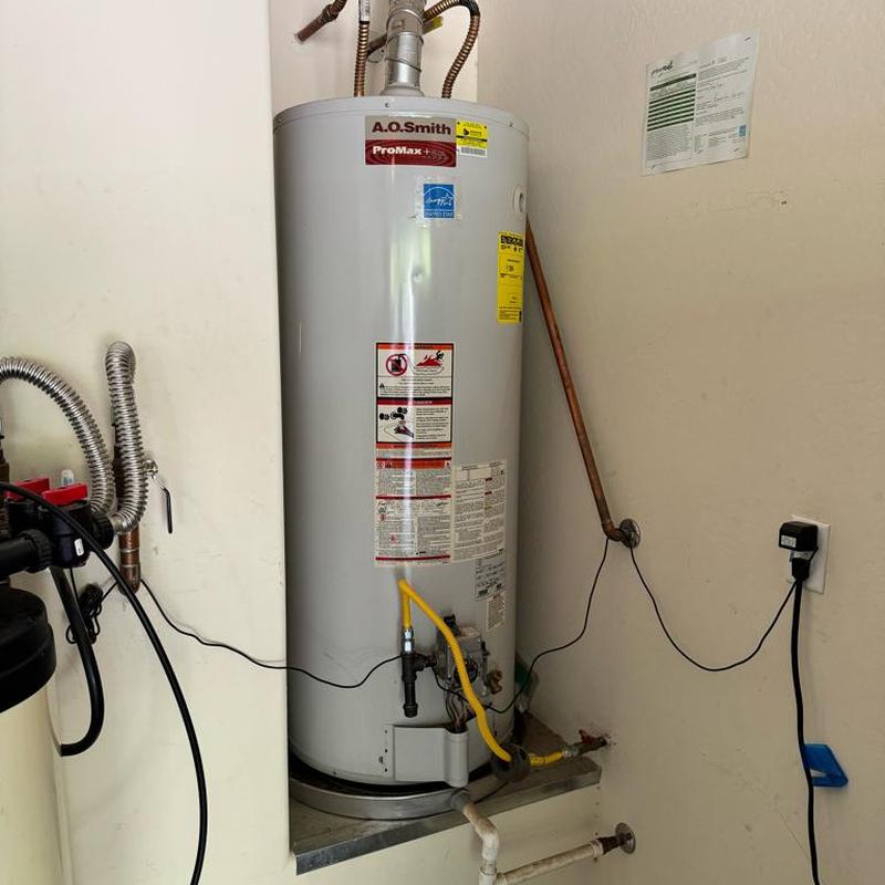 Gas water heater with new sediment trap installed