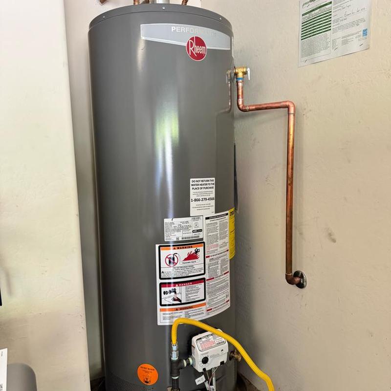 Rheem gas water heater with new sediment trap and piping