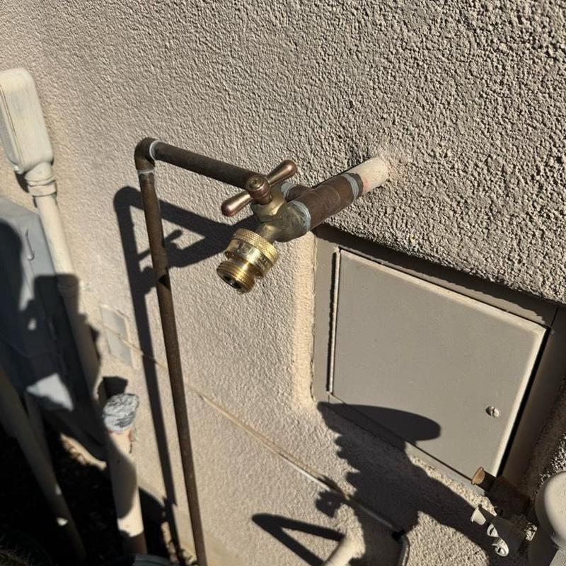 Hose bib with screw-on vacuum breaker installed