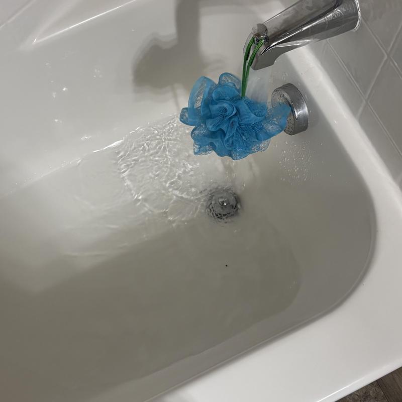 Bathroom tub faucet and drain running water