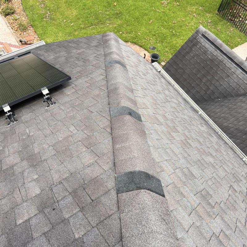 Ridge cap shingles and solar panel roof mounts in Pearland