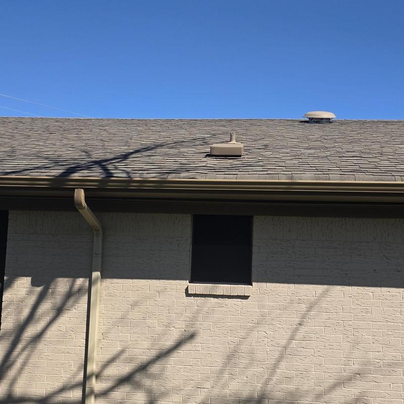 Asphalt shingle roof with hail damage near vents