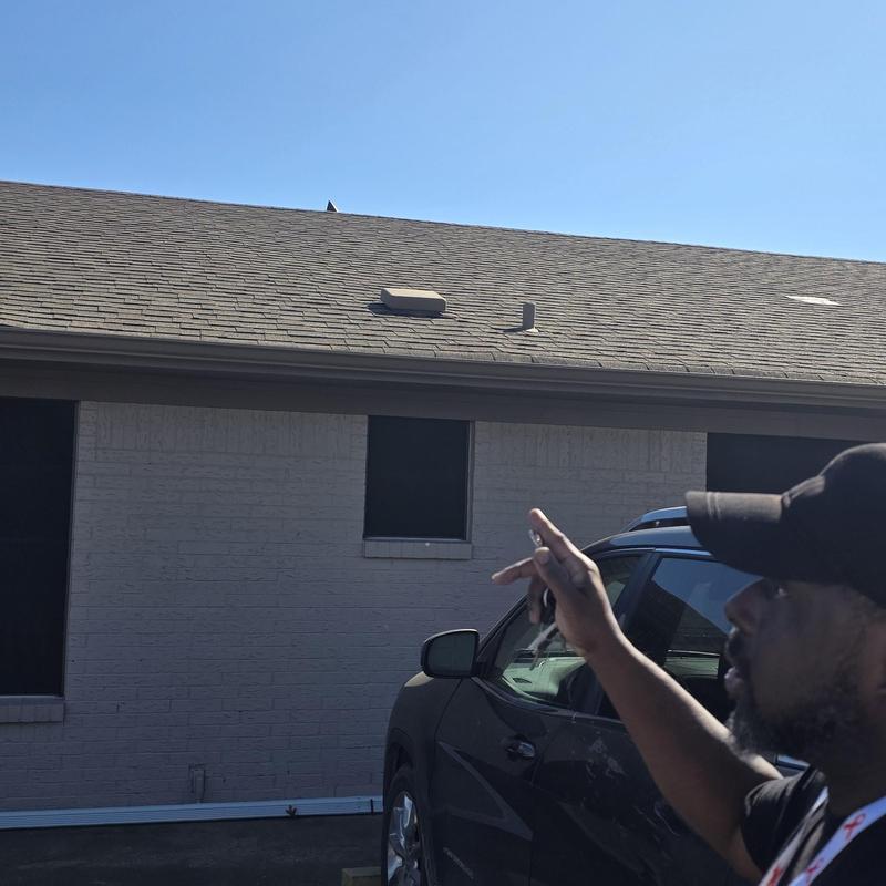 Asphalt shingle roof with hail damage inspection