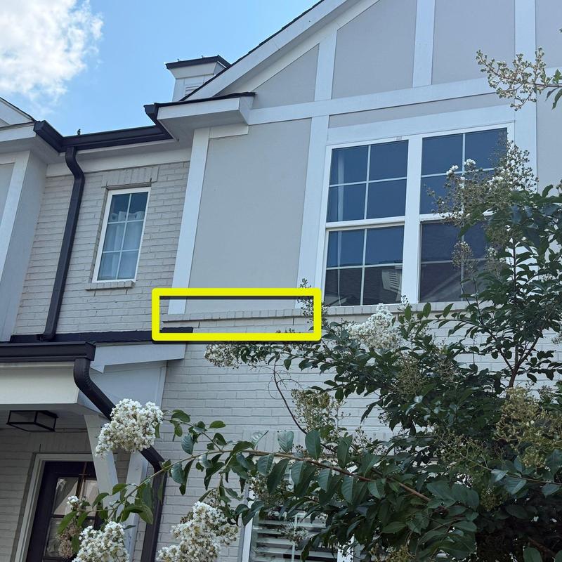 Brick wall section with visible mortar wear and cracks