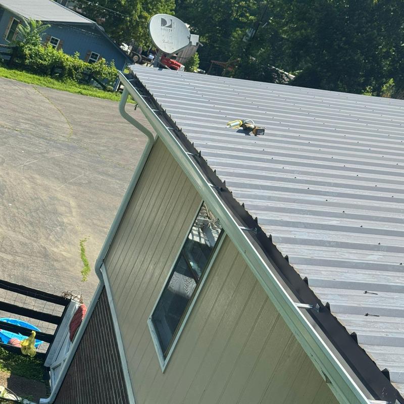 Metal roof inspection with hail damage and repairs planned