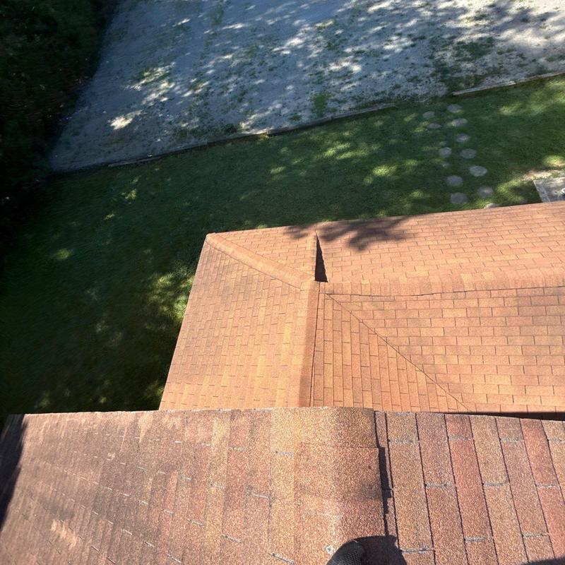 Asphalt shingle roof with hail damage inspection