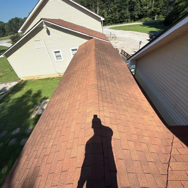 Asphalt shingle roof with hail damage and wear