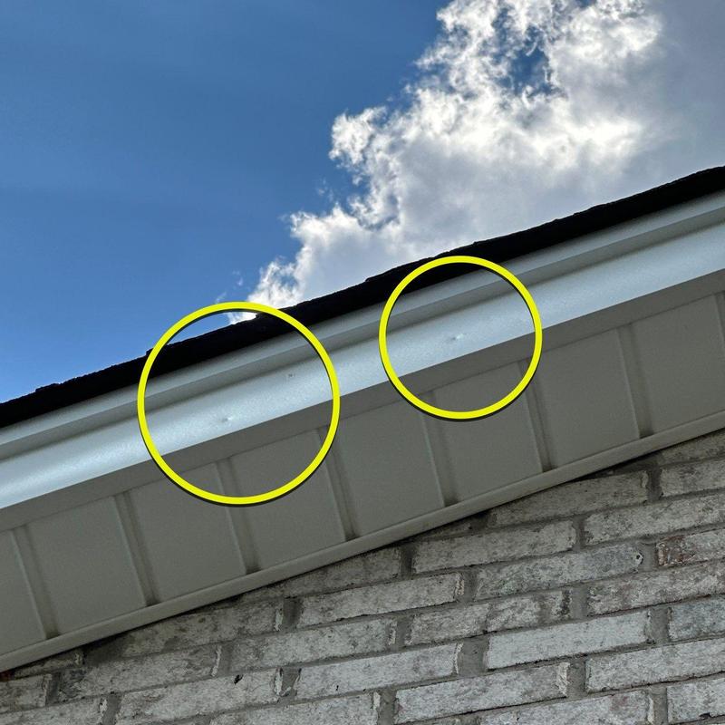 Vinyl soffit dents from hail impact marks