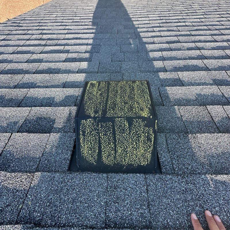 Roof vent with hail damage inspection marks on shingles