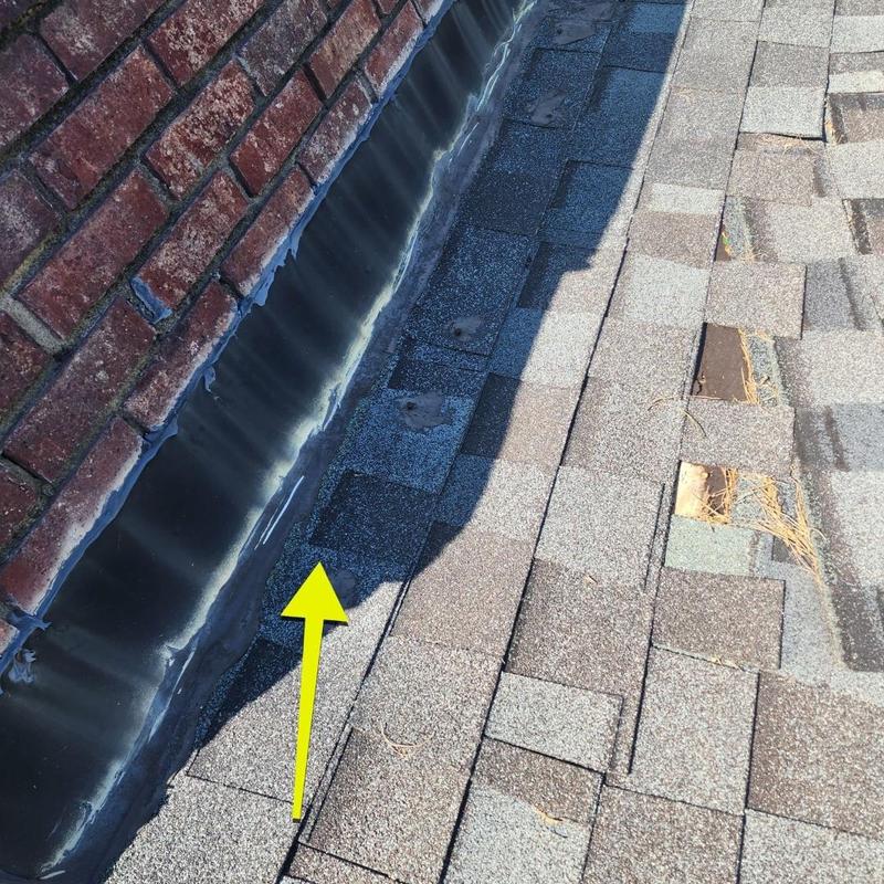 Roof shingles with delaminating and chimney flashing