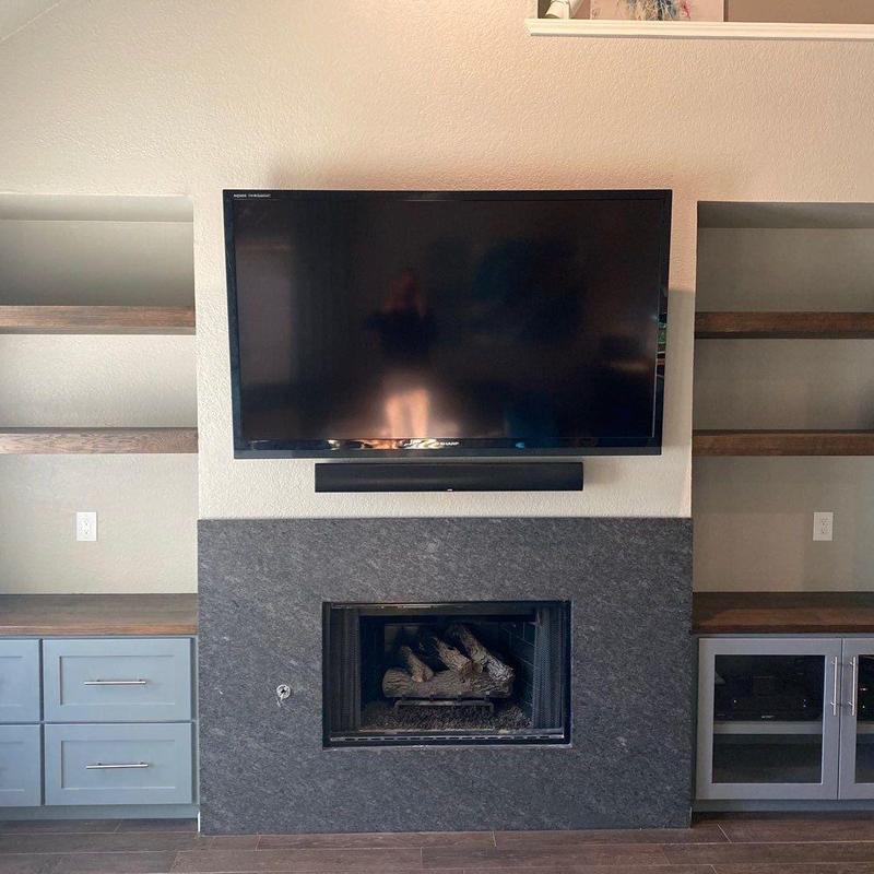 Fireplace surround with TV and built-in shelves