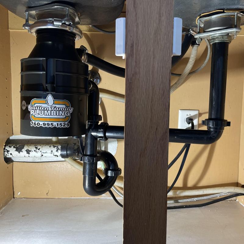 Garbage disposal with new tubular drain lines installed