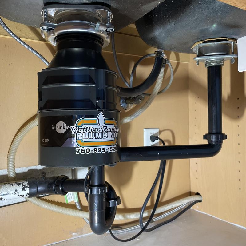 Garbage disposal with new tubular drain lines under sink