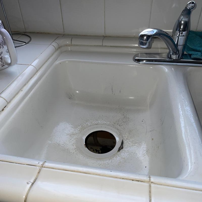 Kitchen sink basin with disposal drain hole