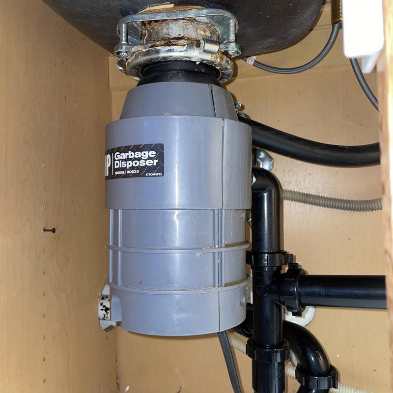 Garbage disposal and drain lines installed under sink