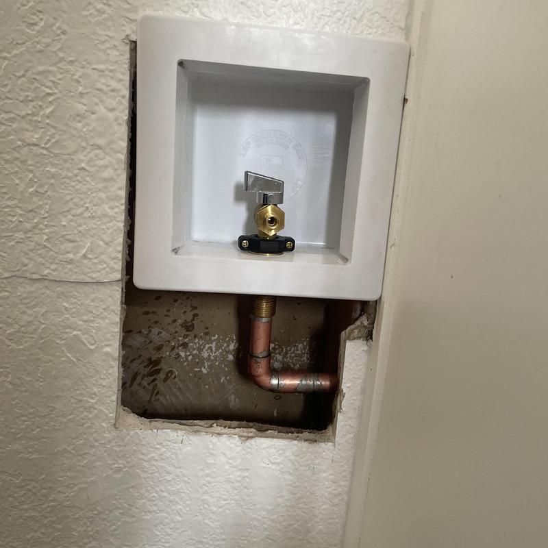 Icemaker shut off valve with copper piping and drywall cutout