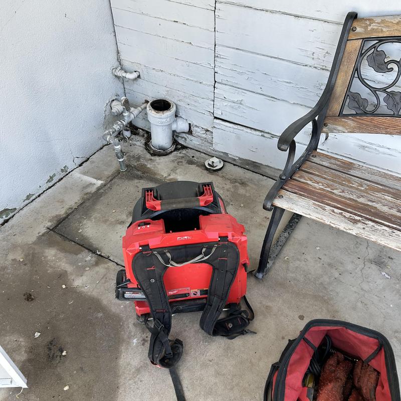 Building drain pipe with drain cleaning machine nearby