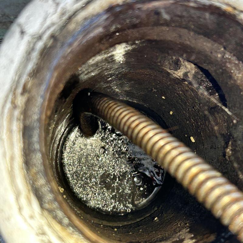 Building drain clogged with sewer cable clearing blockage