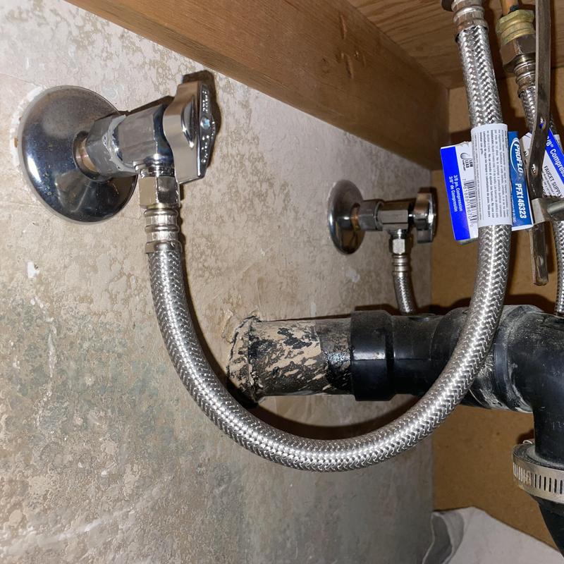 Angle stop valves and stainless steel supply lines under sink