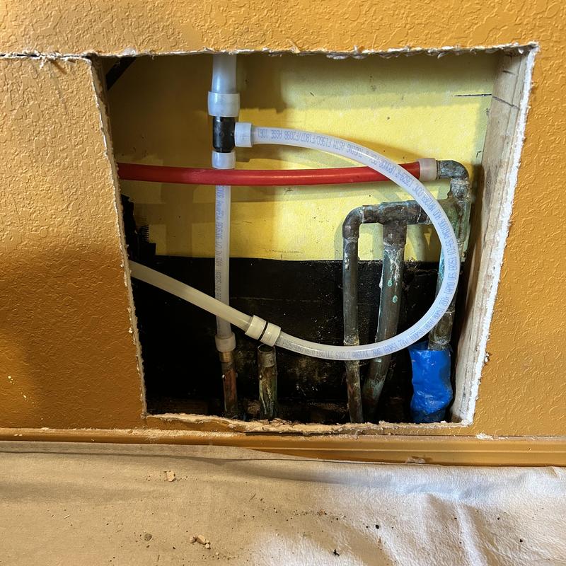 Copper pipe manifold with PEX reroute in wall cavity