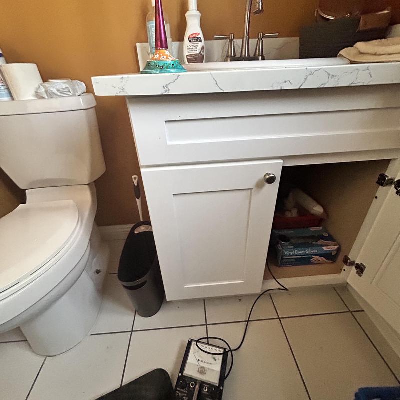 Copper pipe leak detection with tracer wire in bathroom cabinet