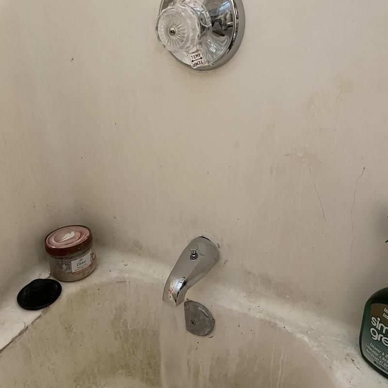 Mixet shower valve and tub spout in bathtub wall