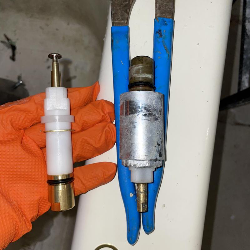 Shower valve cartridges old and new with pliers