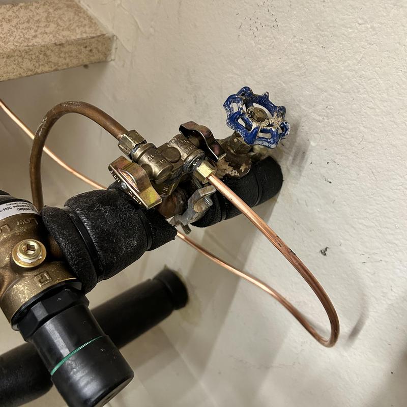 Copper waterline and valve installation near pipe insulation