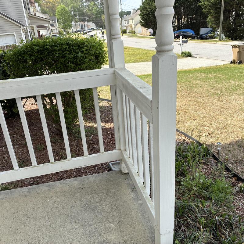 Front porch railings and posts with rot damage