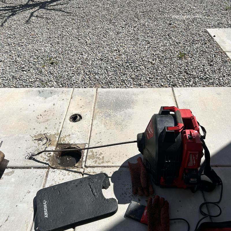 Sewer line clog clearing with machine cable and roots removal
