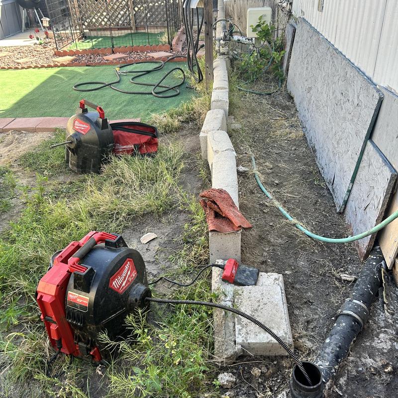 Drain cleaning sewer machine cable clearing roots and debris