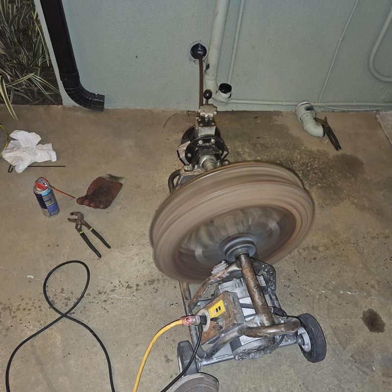Sewer drain cable machine clearing blockage in Santa Ana